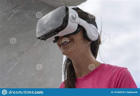 Adolescent Interacting With Innovative Tech Virtual Reality Glasses Smiling And Playing