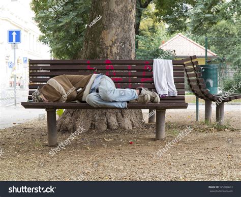 Homeless Man Sleeping On Bench Oneway Stock Photo 125609663 Shutterstock