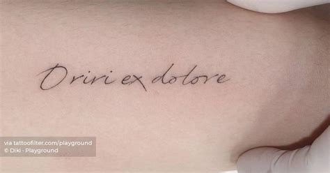 Oriri Ex Dolore Lettering Tattoo On The Inner