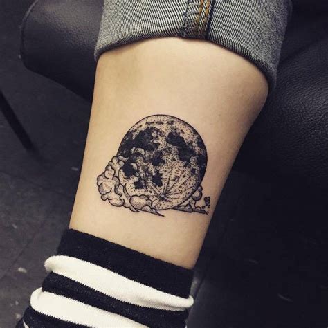 Maybe you would like to learn more about one of these? Illustrative moon and cloud tattoo.
