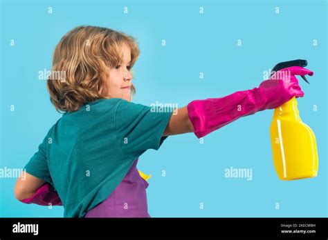 Child Doing Housework Studio Portrait Of Child Use Duster And Gloves