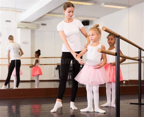Dance Teacher Helping Her Little Girls Students Stock Image Image Of