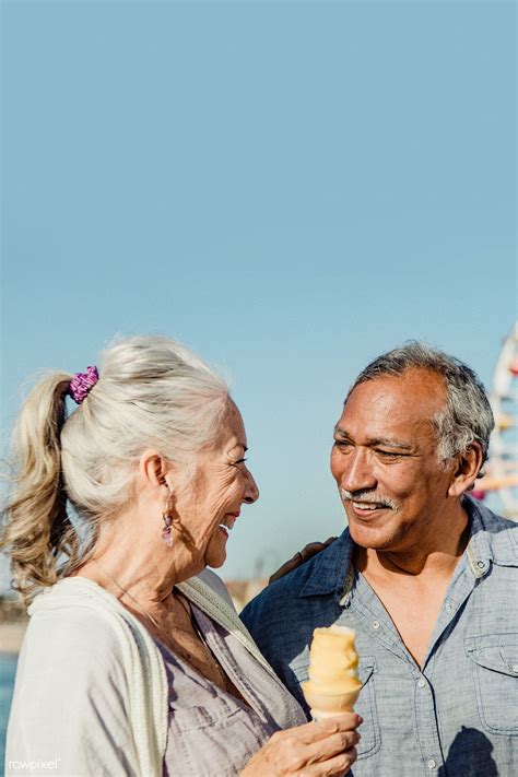 Smiling Senior Couple Having Ice Cream At Santa Monica Pier Premium Image By