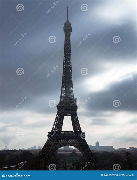 Beautiful Vertical View Of The Eiffel Tower Under The Cloudy Sky During