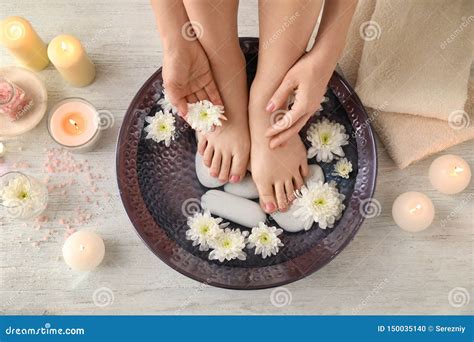 Young Woman Undergoing Spa Pedicure Treatment In Beauty Salon Stock