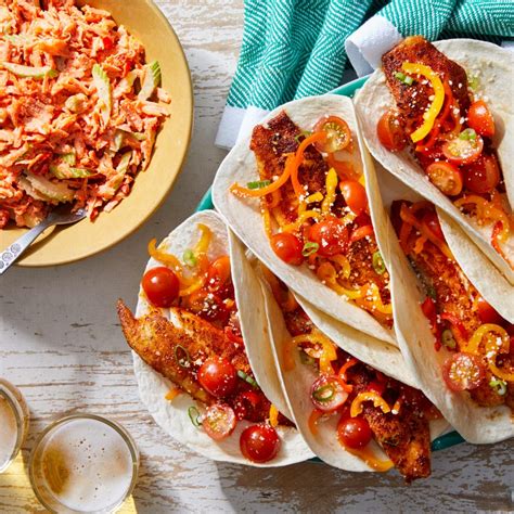This easy fish taco recipe from delish.com will get on swimmingly with your guests. Recipe: Cajun Fish Tacos with Marinated Vegetables ...