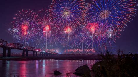 Download Wallpaper 1366x768 Fireworks Night Holiday Bridge Dark