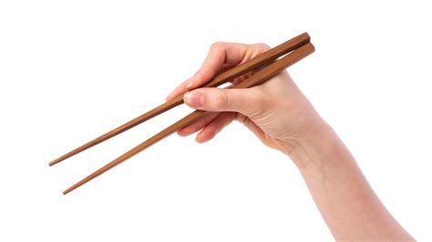 How to hold chinese chopsticks. Here's the right way to use chopsticks
