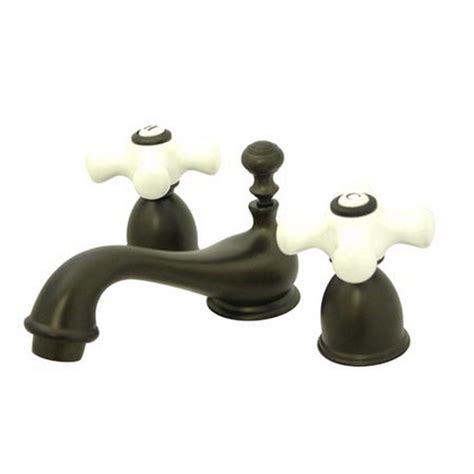 Kingston Brass 4 In Minispread 2 Handle Low Arc Bathroom Faucet In Oil