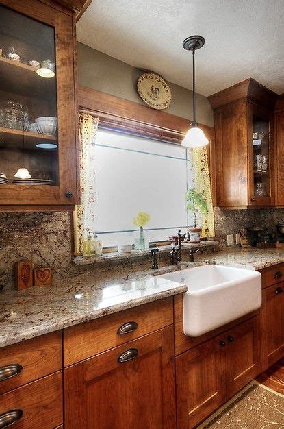 Cabinets over kitchen sink transitional. Glass cabinets, farm house sink, cabinet color, window ...
