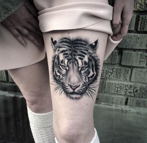 Flower thigh tattoo there are sunflowers, peonies, cherry blooms, lilies, stargazers, carnations, and that's just the beginning. Fluffy Tiger Portrait on Girl's Thigh | Best tattoo design ...