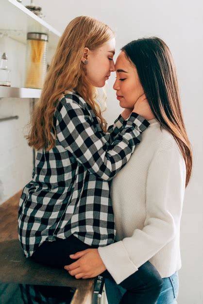 Free Photo Lesbian Couple Standing And Embracing
