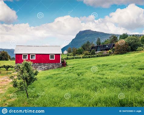 Typical Countryside Norwegian Landscape With Red Painted Wall House
