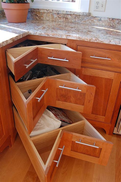 With one of today's growing trends being to rid of base cabinet doors and instead replace with large drawers, many homeowners are finding that corner cabinets are also a great place to place a bank of drawers that can store anything from food to utensils to small. 30 Corner Drawers and Storage Solutions for the Modern Kitchen