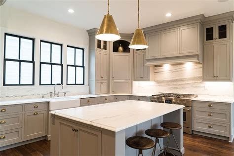 Home spaces monochrome kitchen with gray cabinets and brass hardware. Gray Shaker KItchen Cabinets with Polished Brass Cup Pulls ...