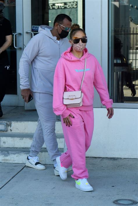 Jennifer Lopez Pops In A Pink Sweatsuit And Plexiglass Nike Air Force 1s