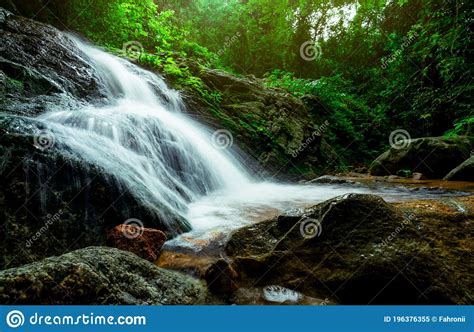 Beautiful Waterfall In Jungle Waterfall In Tropical Forest With Green