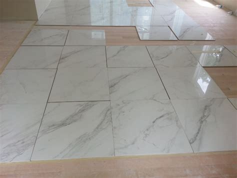 Contessa 23 x 23 porcelain marble look wall & floor tile. marble look alike tile for the foyer