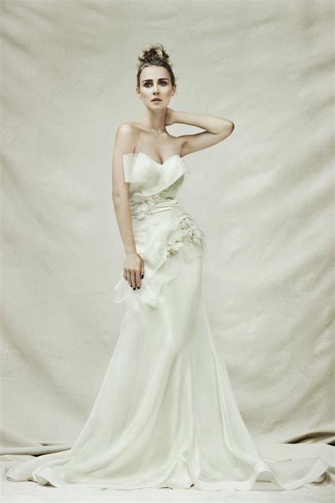 Because of its lightness and beauty, in japan the filigree insect is regarded as a symbol of femininity, with two butterflies symbolising wedded bliss. Pallas Couture Wedding Dresses - MODwedding