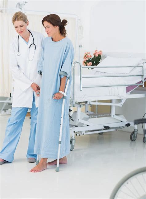 Full Length Doctor Helping Patient Crutches Stock Photos Free