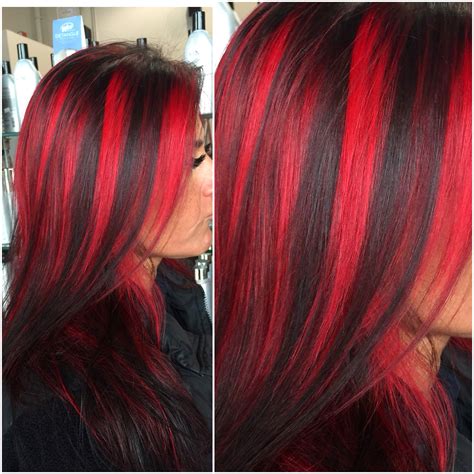 Dark brown hair with caramel blonde highlights. Chunky red highlights by @hairbyangelaalberici Long Island ...