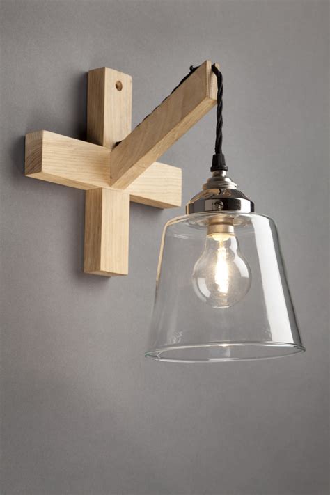 Basically, those wall light fixture allow you to drastically improve the decor of any spaces located indoor or outdoor. Oak glass wall light - Old School Electric