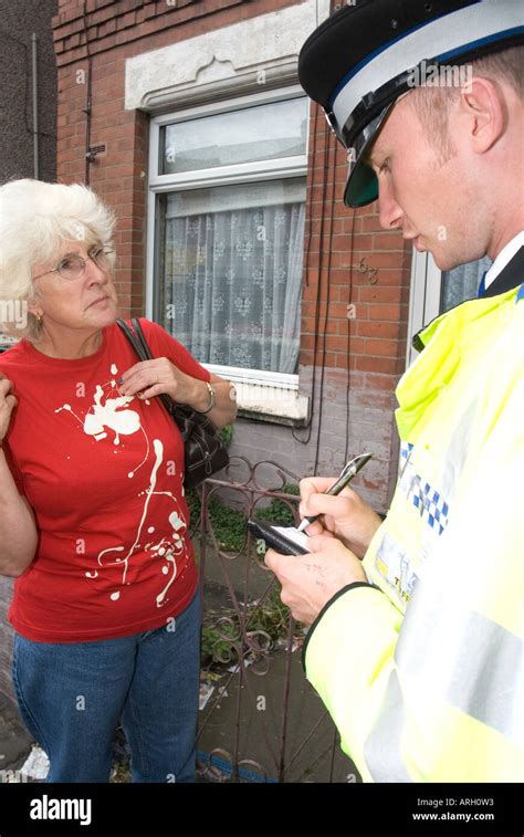A Police Community Support Officer Pcso On Duty In Coventry With Crime Victim United Kingdom