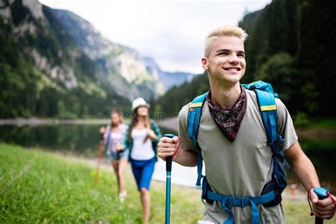 Group Of Happy Young People Friends Hiking Together Outdoor Stock Photo