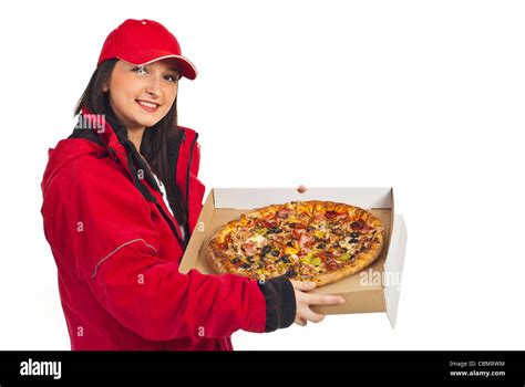 Smiling Pizza Delivery Woman In Red Cap And Coat Holding Pizza Isolated On White Background