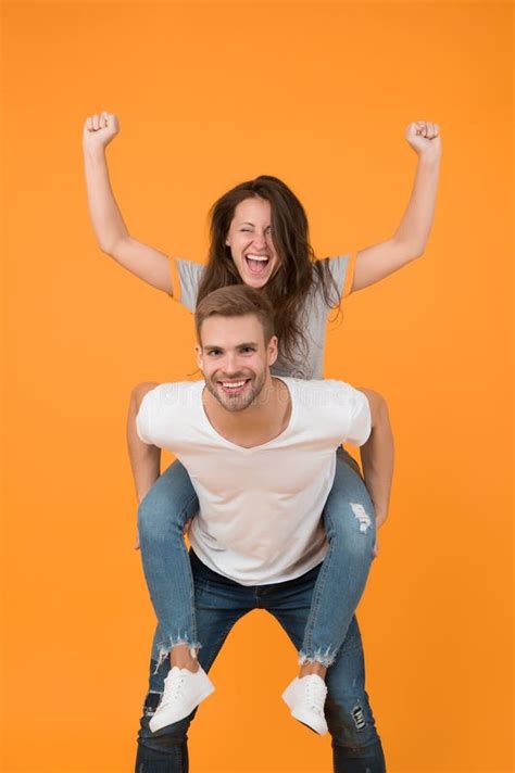 Solid Support Cheerful Man Piggybacking His Girlfriend Hipster Giving