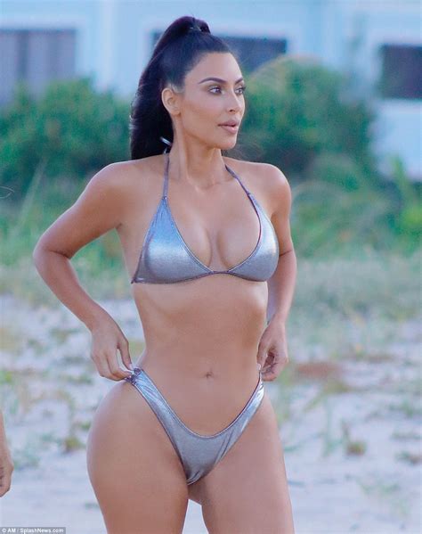 Kim Kardashian Flaunts Her Banging Body In Sexy Silver Bikini Poses In