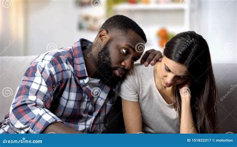 black husband calming and supporting sad wife health problems miscarriage stock image image