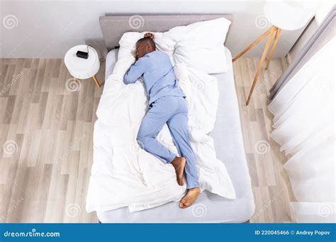 High Angle View Of Man Sleeping On Bed Stock Photo Image Of Duvet