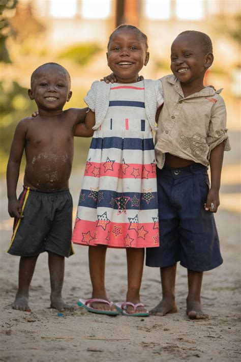 Smiling Black Children Standing On Street · Free Stock Photo