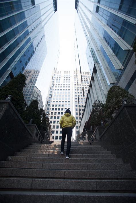 Low Angle Photography Of A Person Walking Up A Stairs · Free Stock Photo