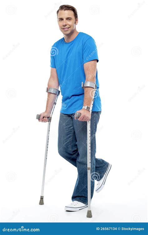 Young Man With Crutches Trying To Walk Stock Photo Image Of