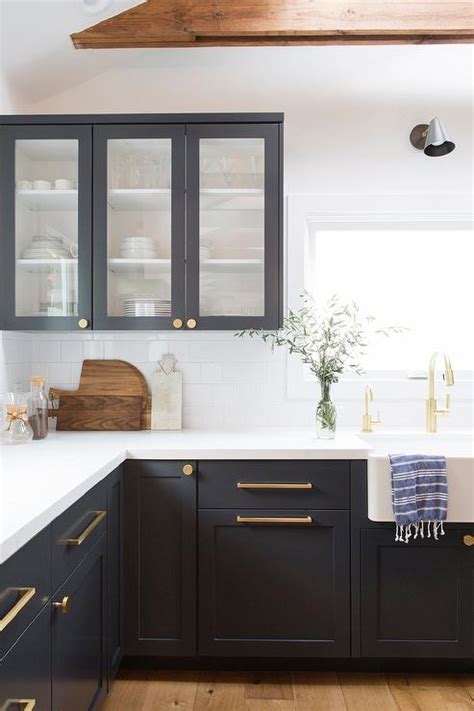 Versatility is a large part of what makes them so timeless. Black Shaker Cabinets with Brushed Gold Pulls and Knobs ...