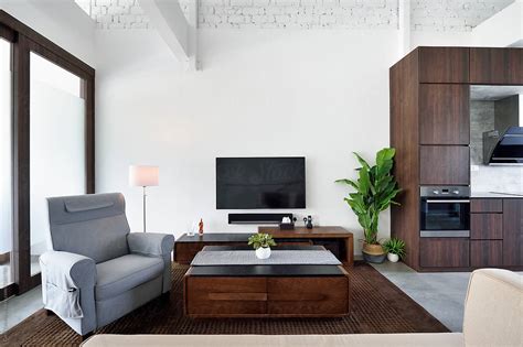 For instance if you choose to have a modern design, black leather furniture in a living room is a great option. Living Room With Sleek, Modern Furniture | Stocksy United