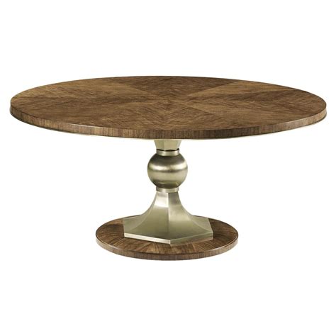 A Mid Century Style Walnut And Steel Round Dining Table The Top Of The