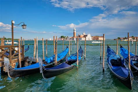 Gondolas And In Lagoon Of Venice By San Marco Square Venice Italy