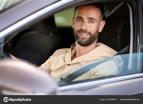 Portrait Confident Smiling Latin Man Driving Car Looking Camera Car