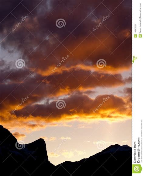 Silhouetted Mountains Orange Sunset Clouds Stock Image Image Of