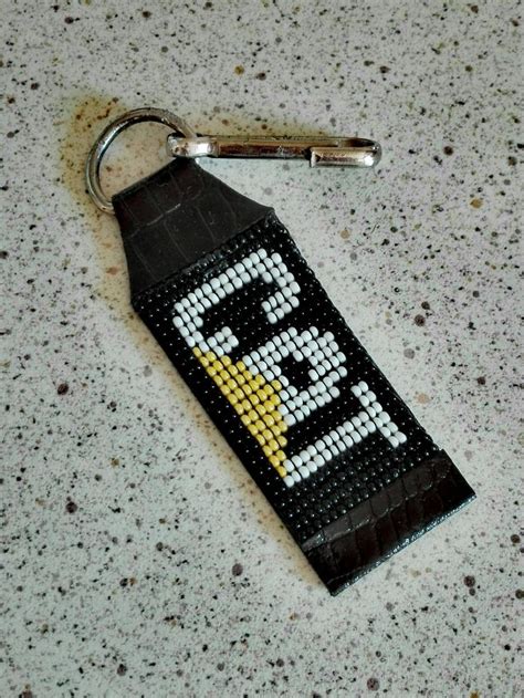 A Keychain Made To Look Like An Old Video Game Character