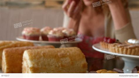 Young Woman Stuffing Her Face With Cake Stock Video 8115517