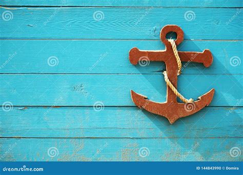 Decorative Wooden Sea Anchor On Blue Wooden Board Children`s Nautical