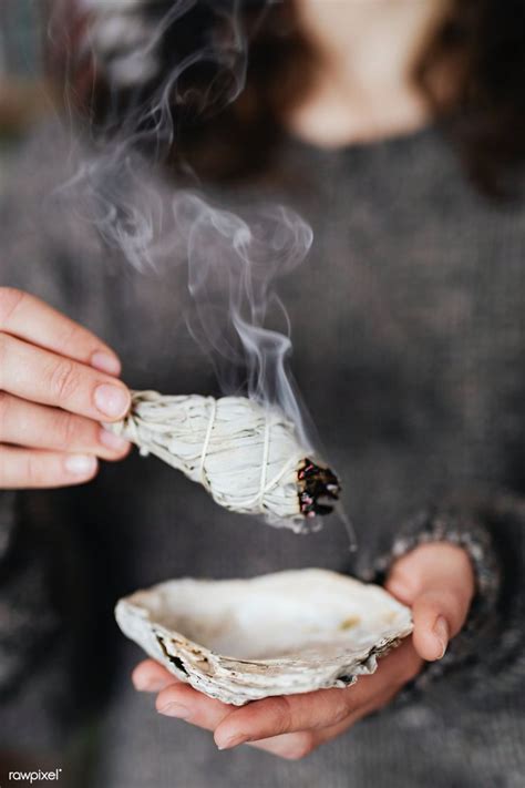 Woman Burning Sage Smudge To Cleanse The House Premium Image By