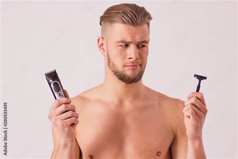 Handsome Naked Man Chooses Electric Shaving Machine Instead Shaver In