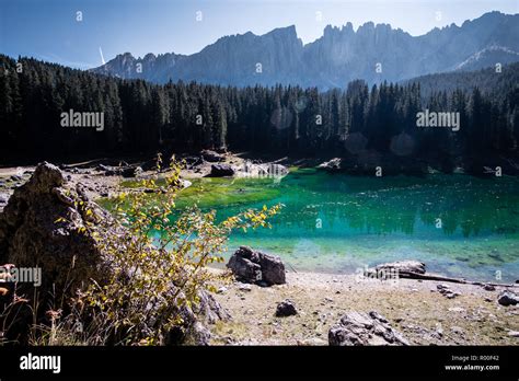 Carezza Lake And Its Turquoise Water In Autumn On The Italian Alps