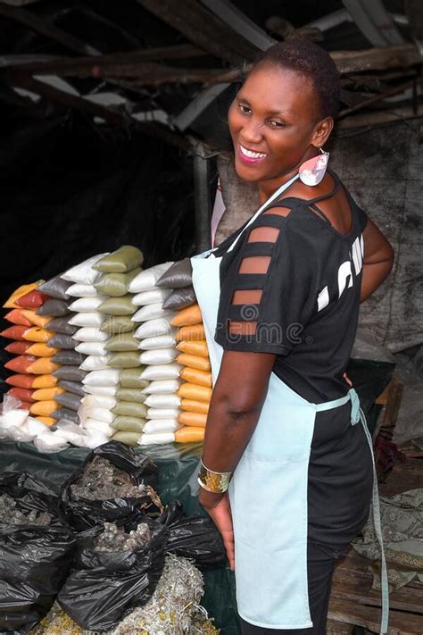 African Lady Posing At Spices And Herbs Market Stand Editorial Image
