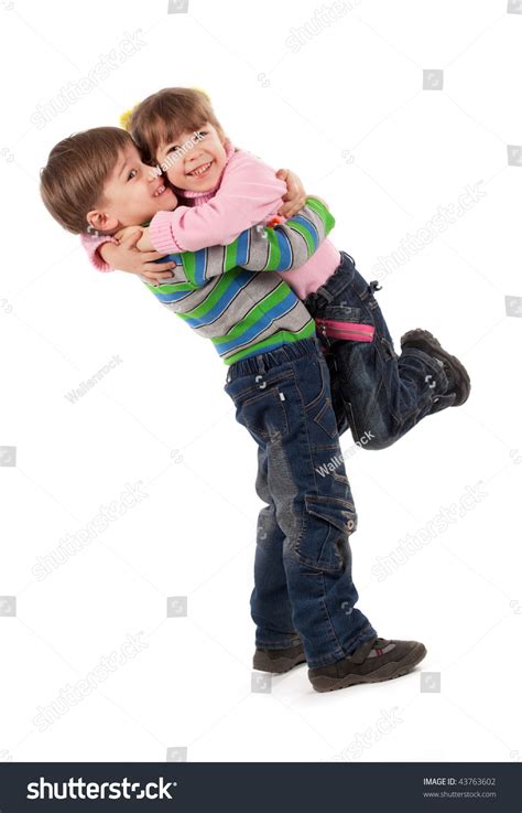 Happy Adorable Kids Hugging Each Other Stock Photo